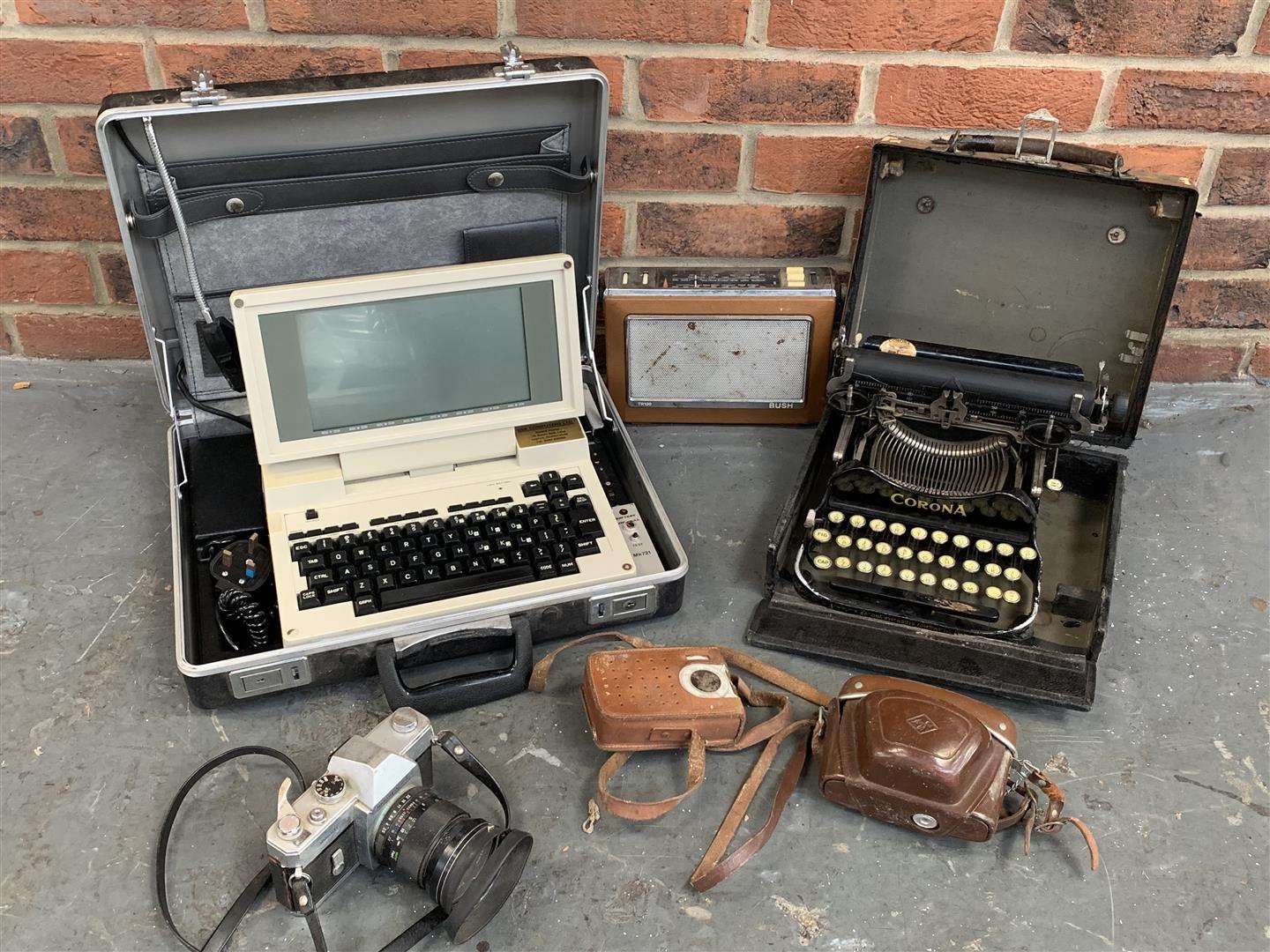 <p>Ex Goodwood Tandy portable computer, Corona typewriter &amp; 3 vintage cameras</p>