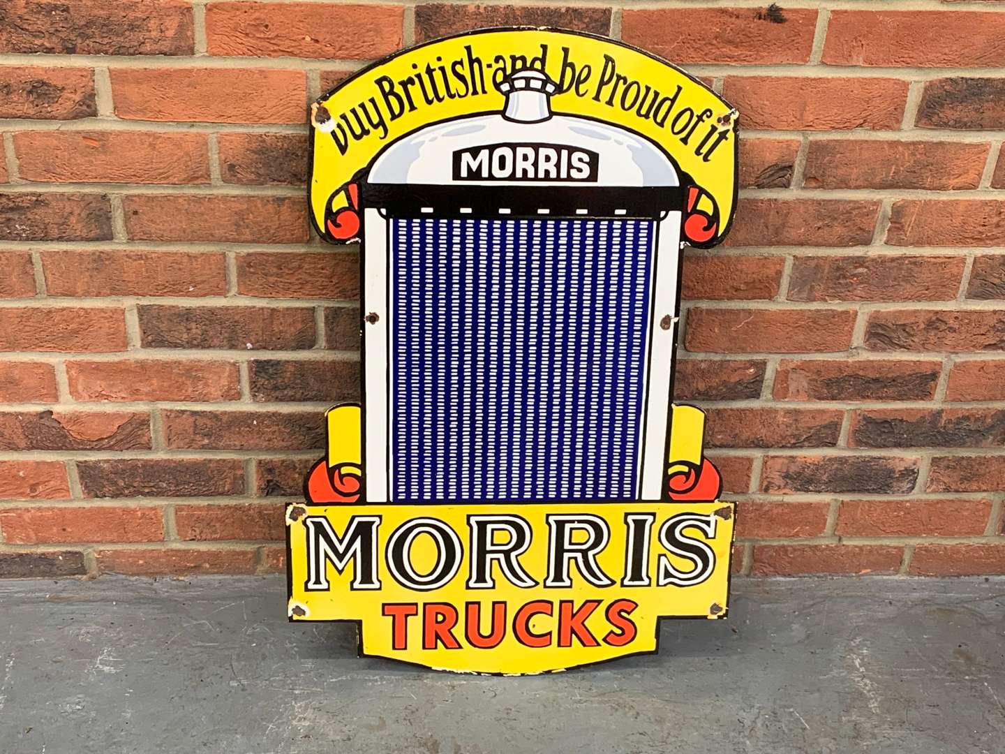 <p>Enamel Morris Trucks Sign</p>