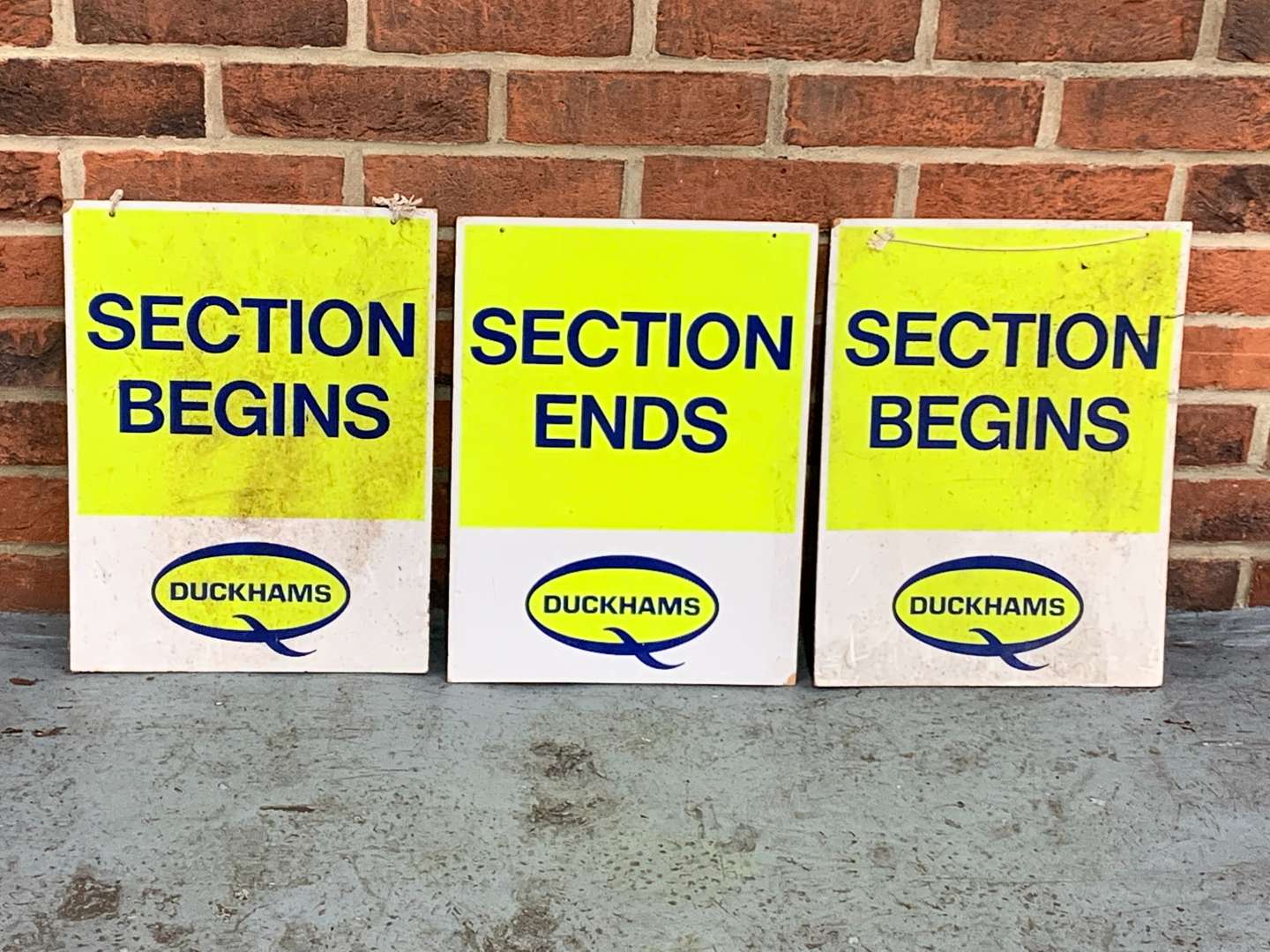<p>Three Duckhams Signs Section Begins/Ends Signs on Board</p>
