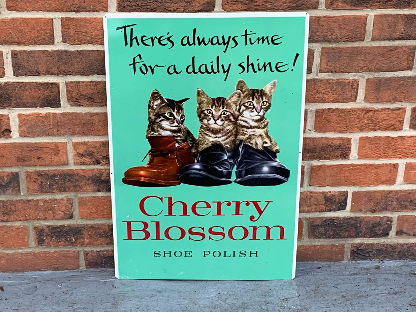 <p>Tin Cherry Blossom Shoe Polish Sign</p>