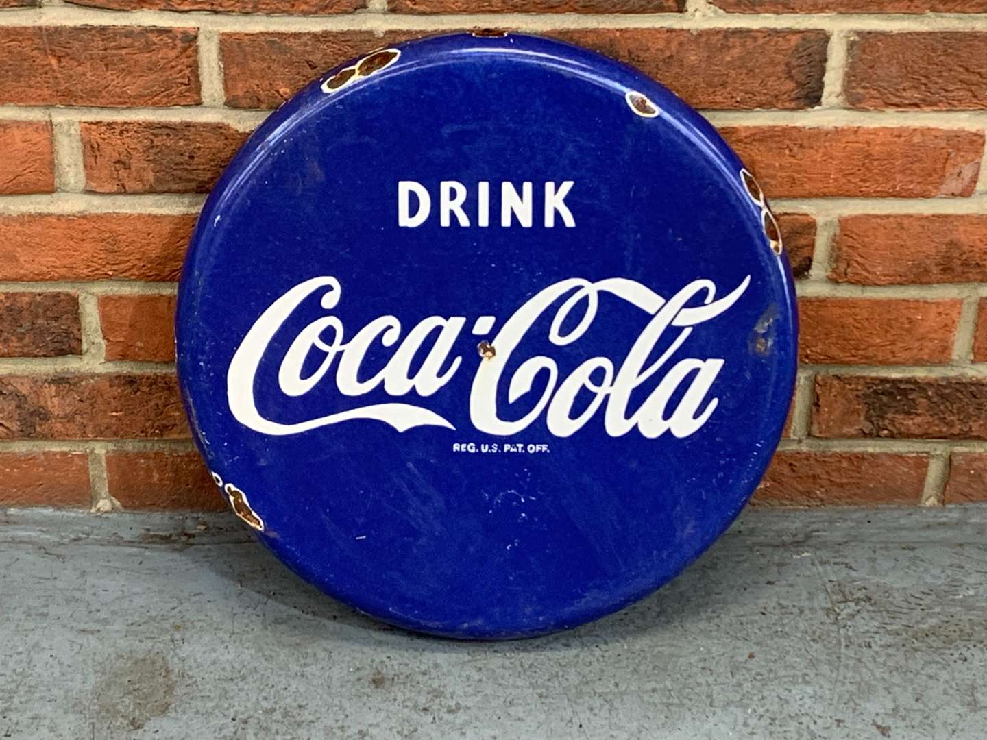 <p>Drink Coca-Cola Enamel Button Sign&nbsp;</p>