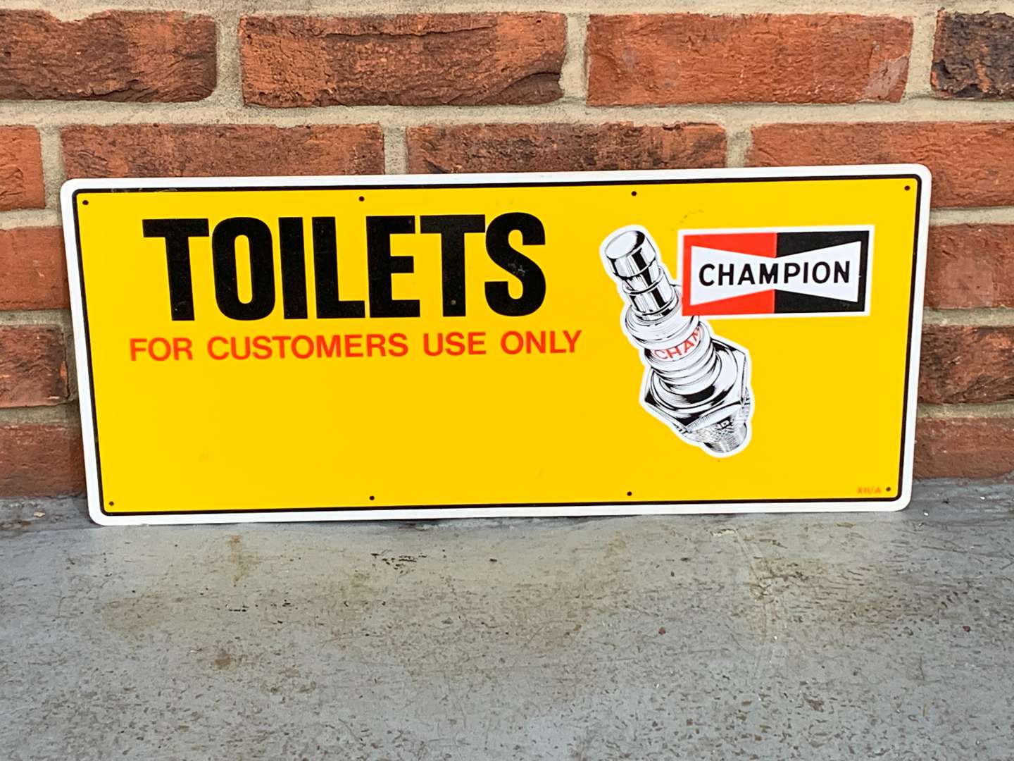 <p>Champion Spark Plug Toilets Aluminium Sign</p>