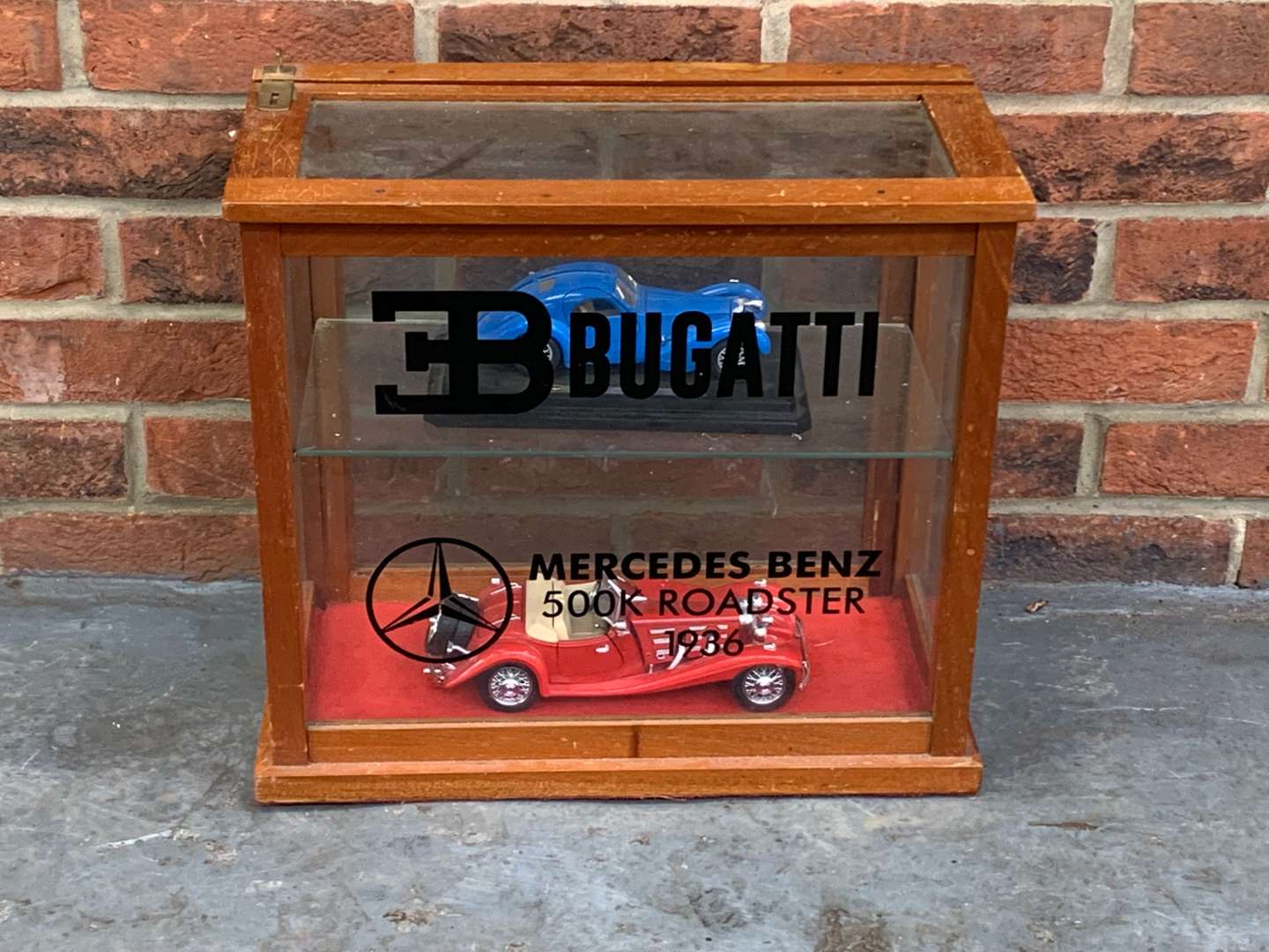<p>Bugatti and Mercedes Liveried Display Cabinet and Models</p>