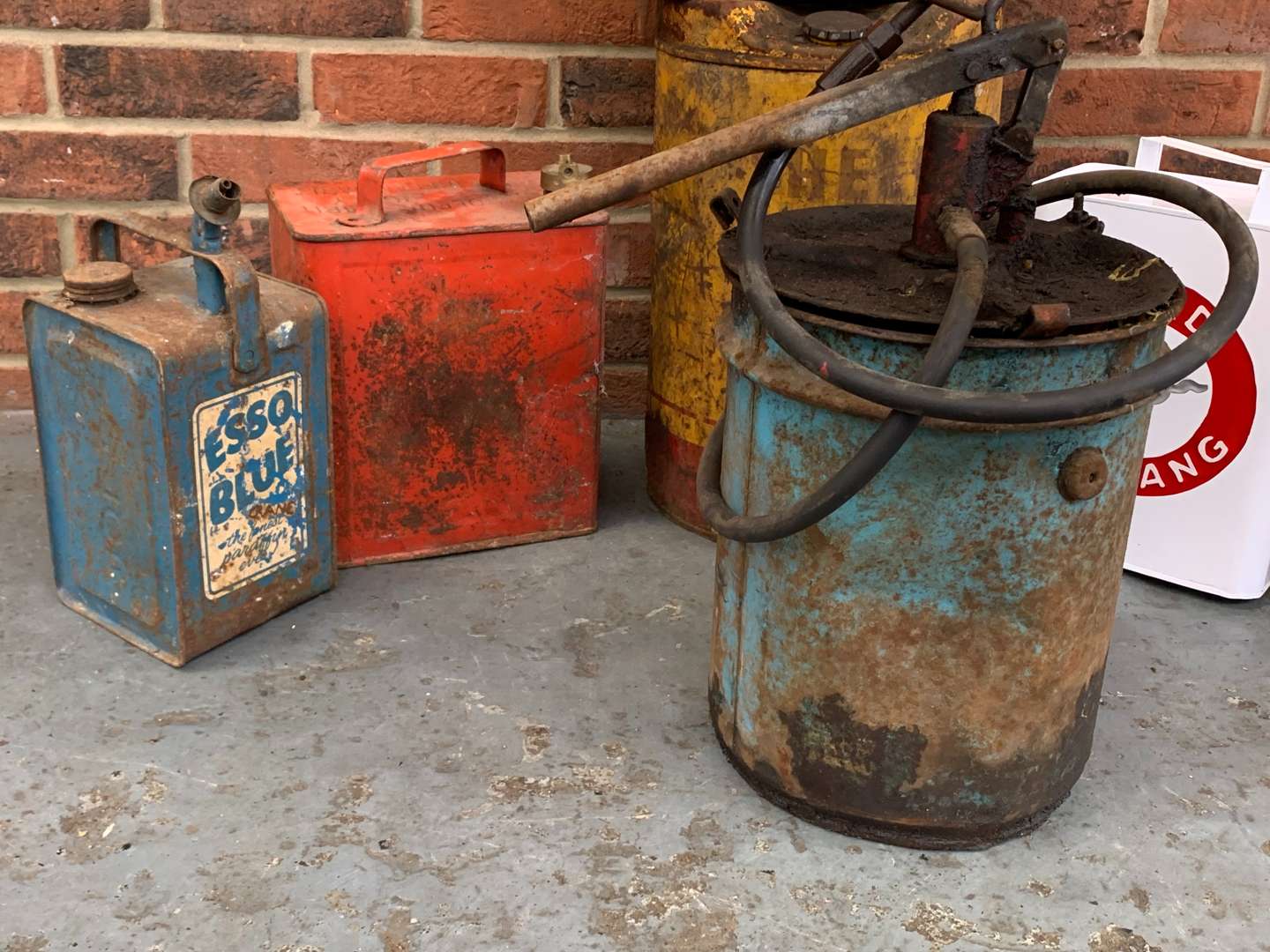 <p>Seven Mixed Grease and Fuel Cans</p>