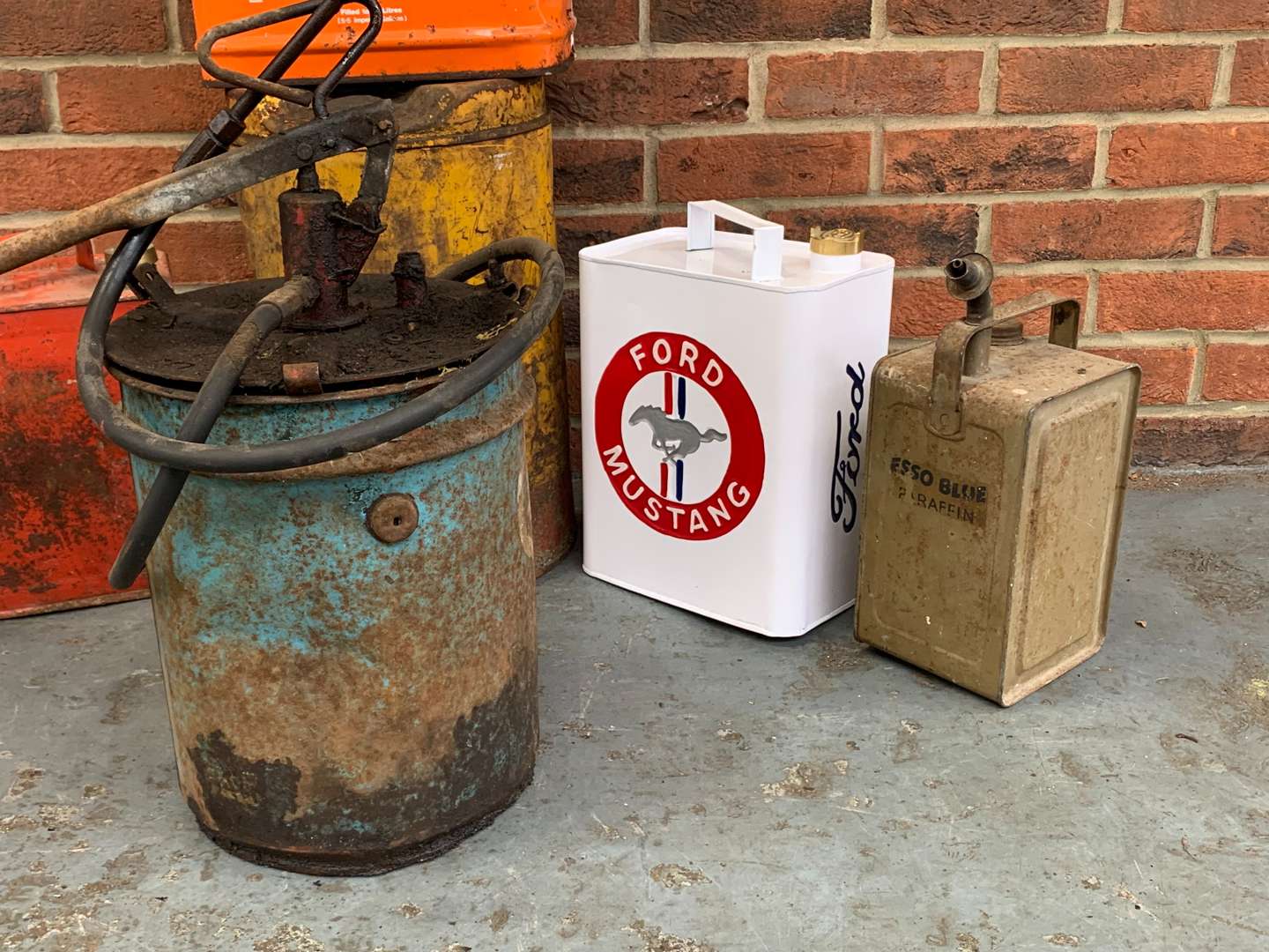 <p>Seven Mixed Grease and Fuel Cans</p>