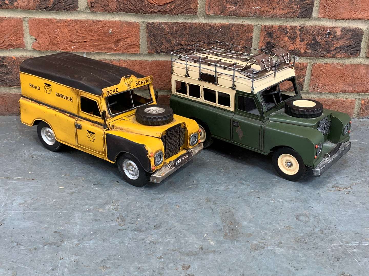 <p>Two Modern Metal Land Rover Model Cars</p>