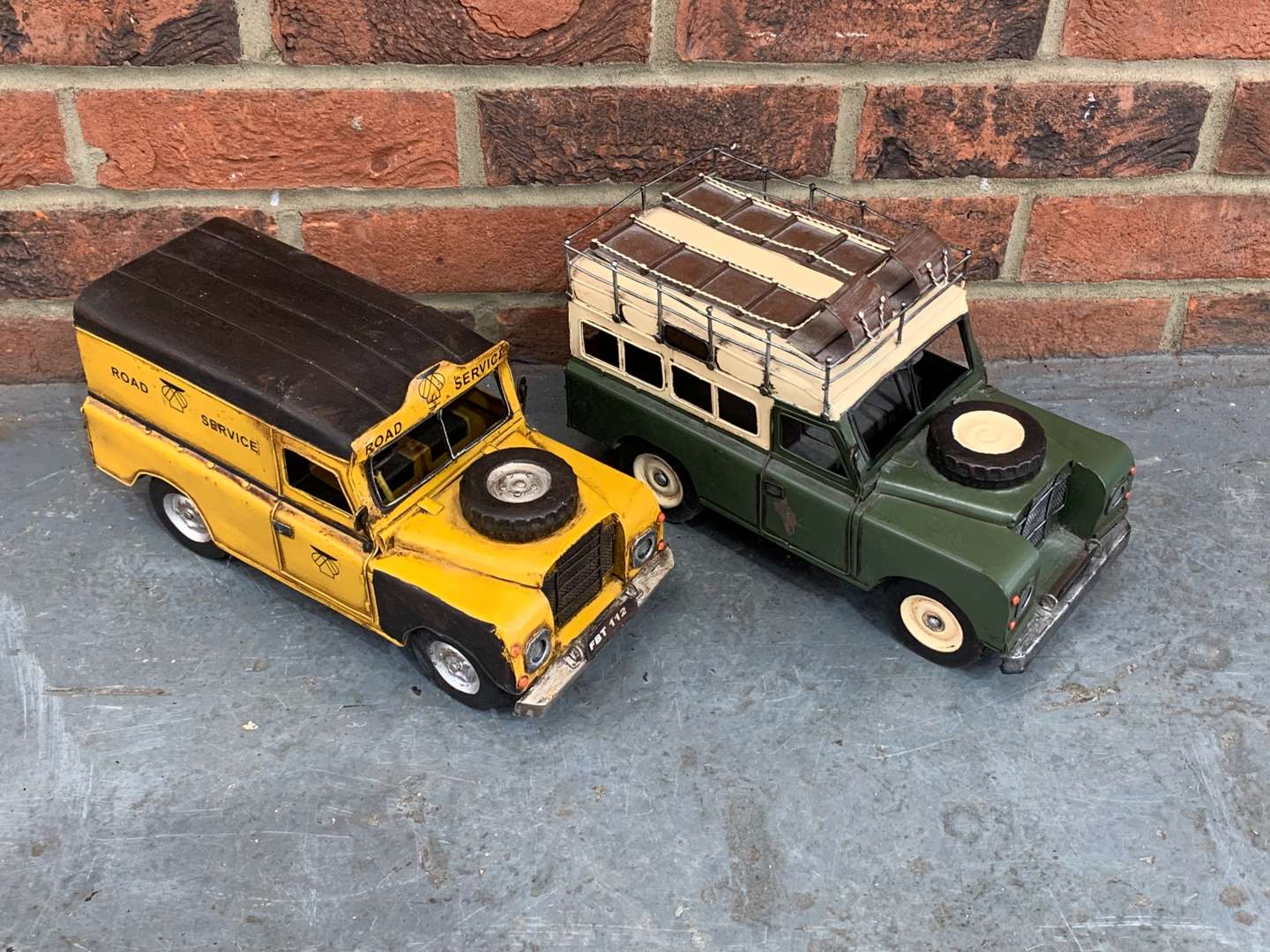 <p>Two Modern Metal Land Rover Model Cars</p>